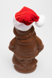 Unwrapped chocolate Santa Claus with Santa hat, from behind, white background, icon image, Christmas time, Unwrapped chocolate Santa Claus with Santa hat, from behind, white background, icon image, Christmas time,